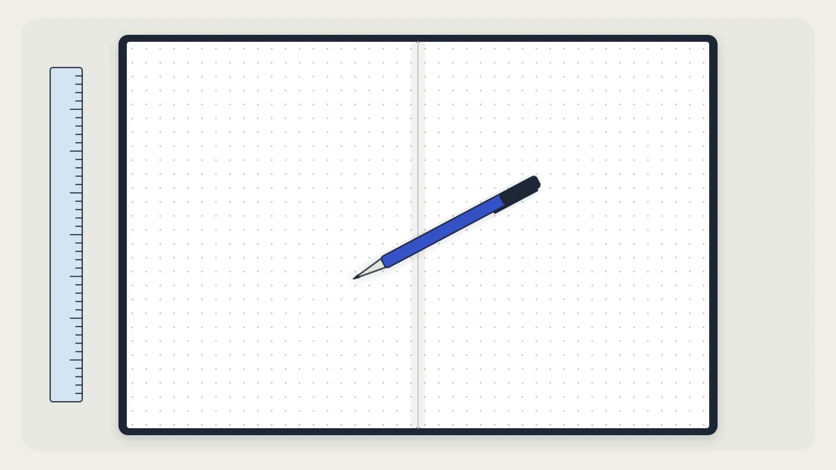 An open blank dot-grid notebook on a desk with a pen lying across it and a ruler beside it